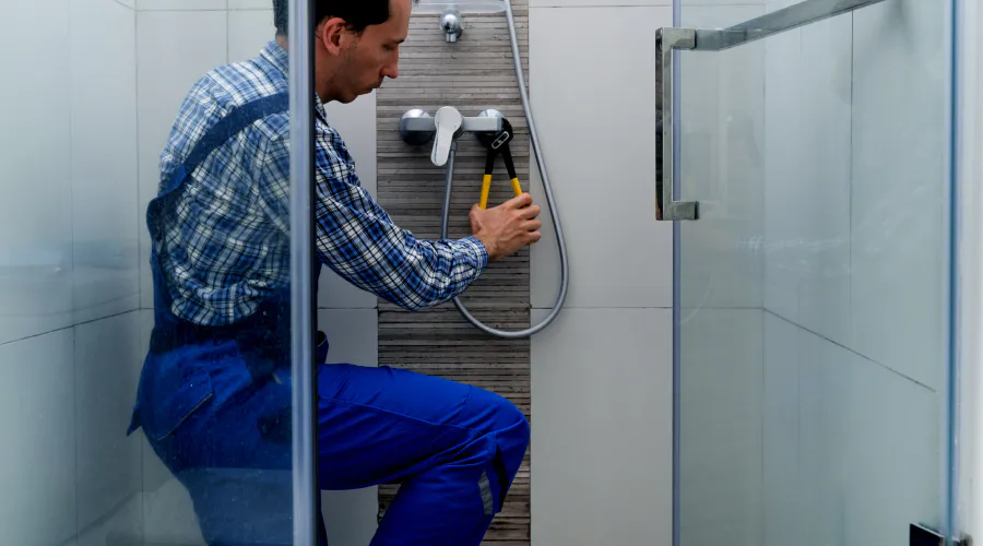 a plumber repairing a shower valve summerville sc