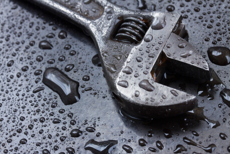 a wrench on a wet surface